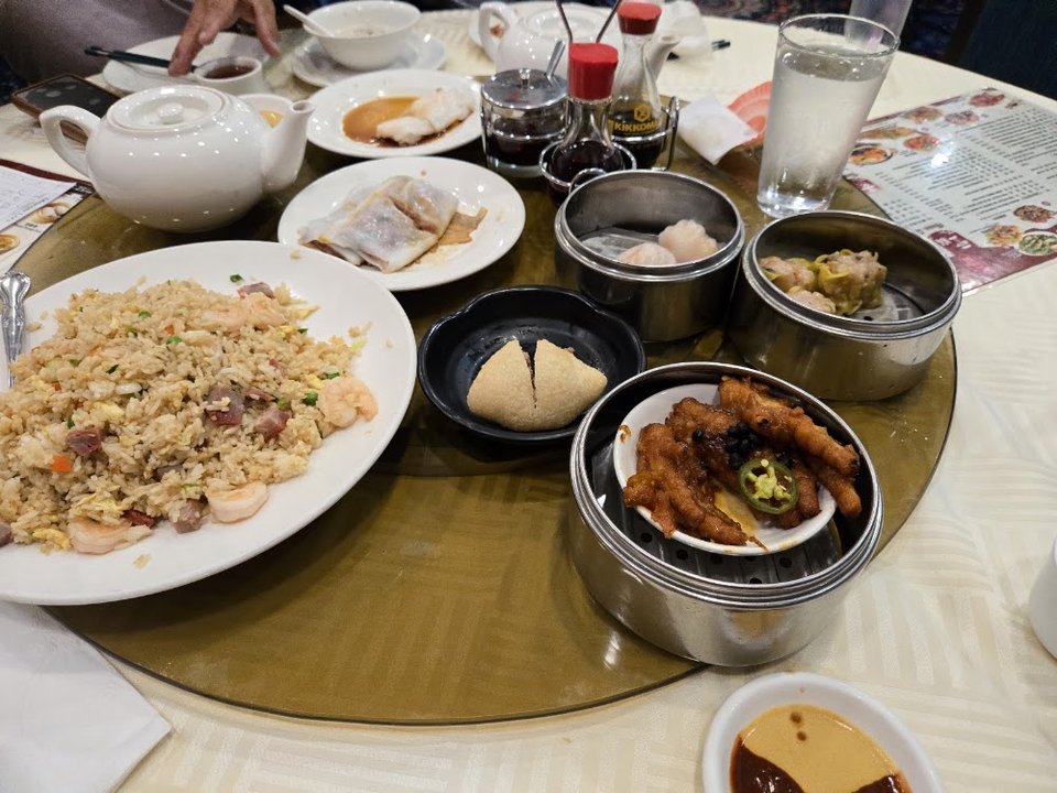 Menu board with seafood and dim sum sections.