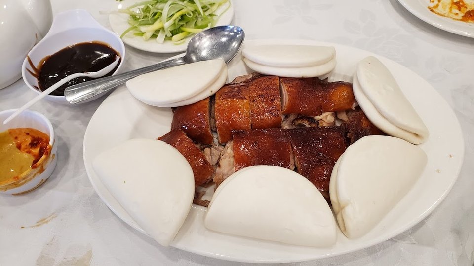 Restaurant menu with Chinese dishes and categories.